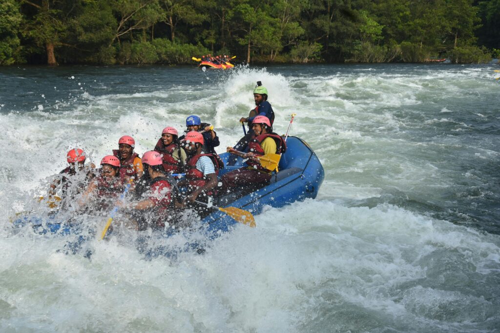 A group of people enjoy an exciting white water rafting adventure on a sunny day.